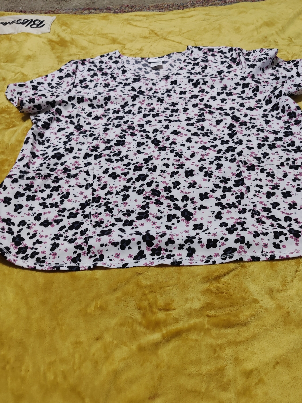 NWOT Scrubstar White Top with Black and Pink Floral Pattern Front Pockets